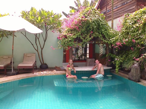 Outdoor pool, pool umbrellas, sun loungers