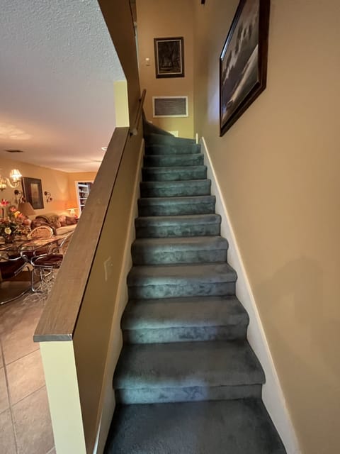 Primary bedroom downstairs, two more bedrooms, bath and laundry upstairs