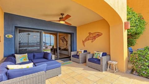 Large ground floor beachfront patio with generous seating — perfect for morning coffee or sunset cocktails