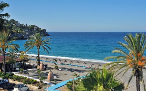 On the beach, sun loungers, beach umbrellas