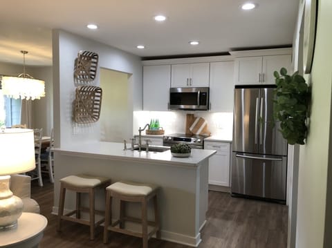 Full Kitchen. Stainless appliances. Large shelves in Pantry. Lots of lighting.