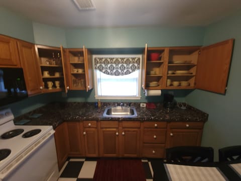 Alternate view of kitchen 1 showing dishware