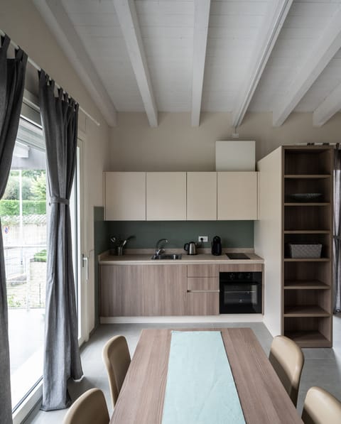 Family Room, Pool View | Private kitchen | Fridge, stovetop, electric kettle, highchair