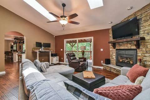 Living room with plenty of seating to enjoy the flat screen TV & gas log fireplace.
Notice the laptop workspace in the background! Two monitors for you to use plus a printer!