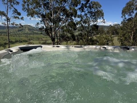 10 seater spa taking in the Paterson River valley and Barrington's range