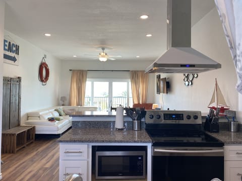 Beautiful beachfront condo with 14 foot slider to private patio facing the beach