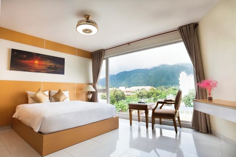 Deluxe Room, 1 King Bed, Mountain View | Minibar, in-room safe, desk, blackout drapes