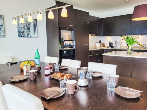 Furniture, Interior Design, Flooring, Countertop, Light Fixture, Chair, Table, Ceiling, Kitchen & Dining Room Table, Kitchen