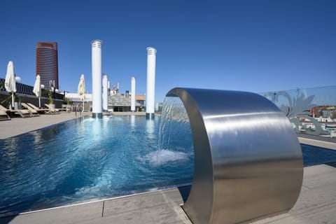 Outdoor pool, pool umbrellas, sun loungers