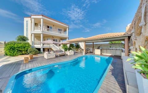 The villa features a private pool & sublime outdoor dining & lounge area. 