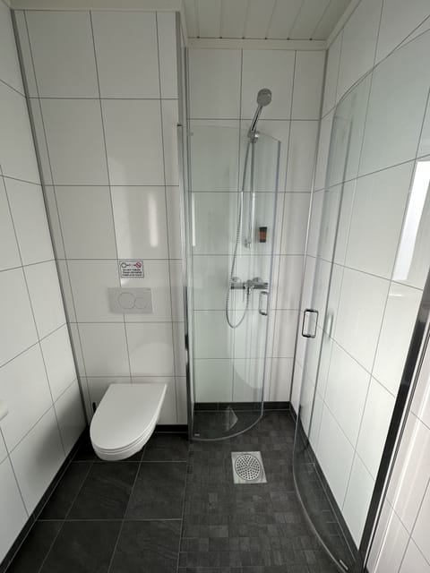 Seaview Rorbu Toft | Bathroom | Shower, free toiletries, heated floors, towels