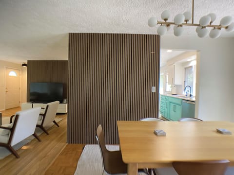 Enjoy meals in around the dining room table with seating for 6-8.