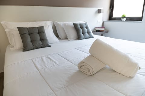Premium bedding, down comforters, memory foam beds, minibar