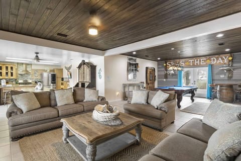 Spacious living room w/ sectional seating & coastal-style finishes