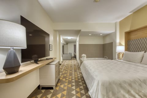 Suite, 1 King Bed | Premium bedding, in-room safe, individually decorated, desk