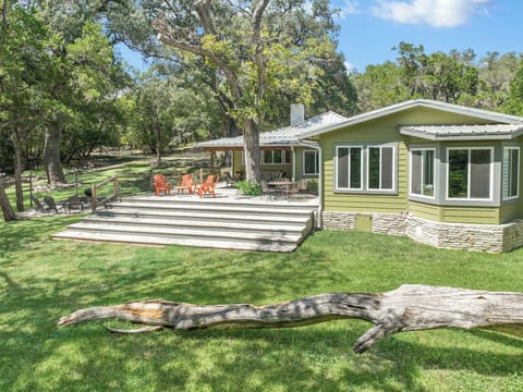 This private retreat features a spacious deck with outdoor seating