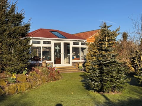 Front view of lodge with new 'warm roof'