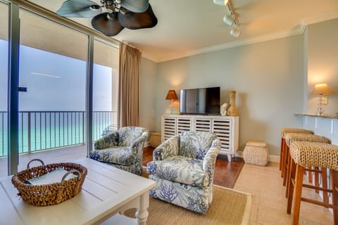 Swivel Chairs, 65" smart tv, pottery barn seagrass rug.