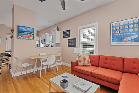 open floor plan with bright, airy living room and kitchen table