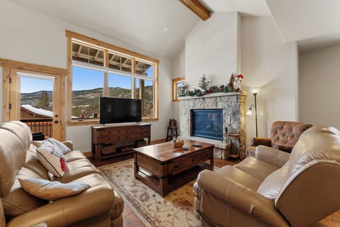 Cozy up in your mountain retreat with plush leather seating, crackling fireplace, and stunning views.