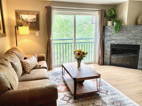 Family room with flat screen TV & balcony
