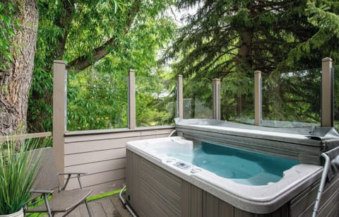 Private deck amongst the trees with an 8-person hot tub to relax in after a long day of adventuring in Park City!