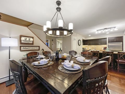 Gather for a meal together at the dining table with seating for 6 and 3 extra seats at the kitchen island
