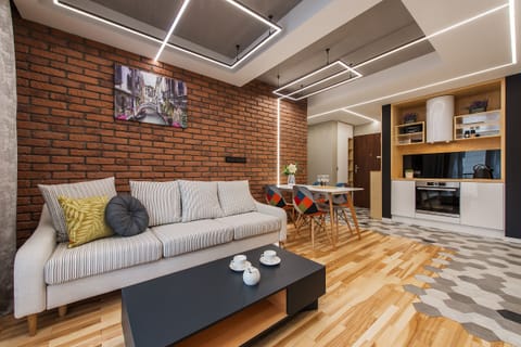 Luxury Apartment | Living area | Flat-screen TV