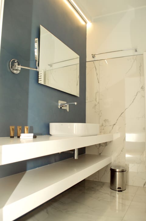 Shower, designer toiletries, hair dryer, bidet