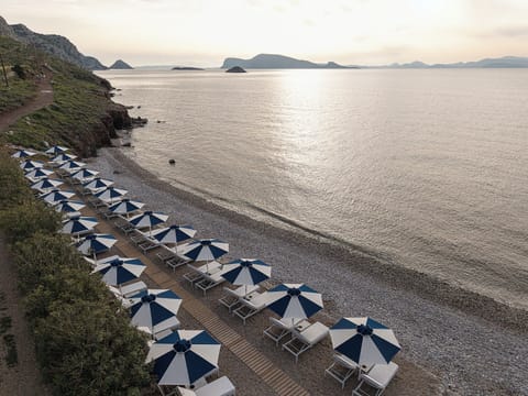 On the beach, beach shuttle, sun loungers, beach umbrellas