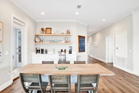 The wet-bar has a sink and separate ice maker