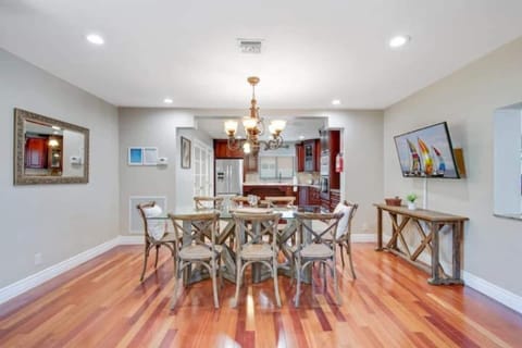 Open dining area seats 8 with easy access to kitchen.