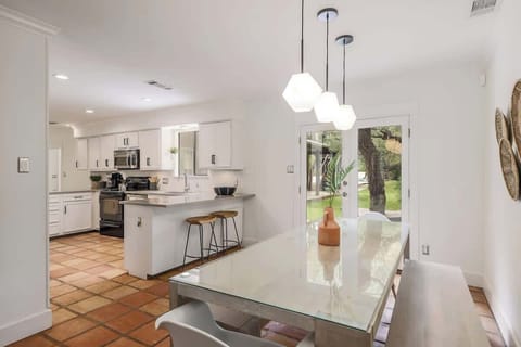 Enjoy views of the lush backyard from the small dining table.