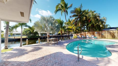 Relax by the pool on our lounge chairs or enjoy an outdoor meal on the water!