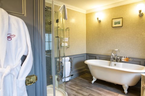 Designer toiletries, hair dryer, slippers, towels