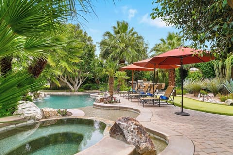A tropical oasis of mature plantings - hibiscus, citrus, bird of paradise and palms