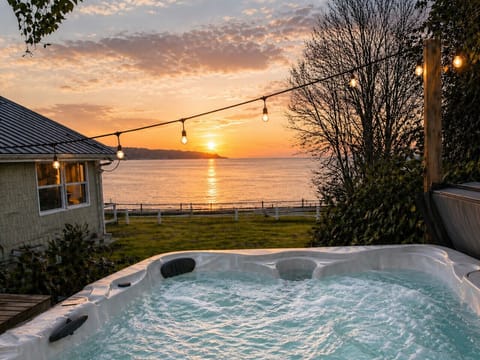 Covered Outdoor Hot Tub with Water View