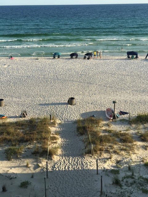 View from living room balcony. Only a few steps to the white sand! 