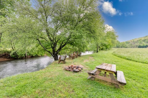 Riverside firepit, picnic table, and chairs