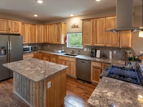 Create culinary delights in our fully equipped kitchen on the main level.