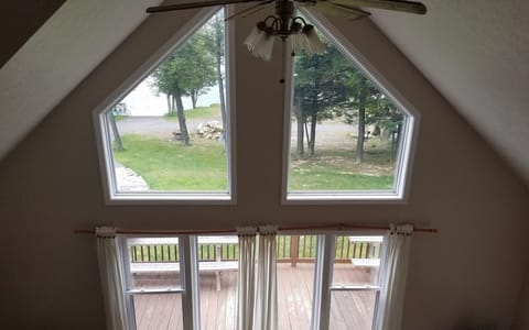 view from loft - large windows provide great views of yard and lake
