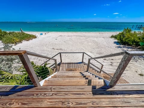 Walk out your front door for toes in the soothing sand on your private beach.