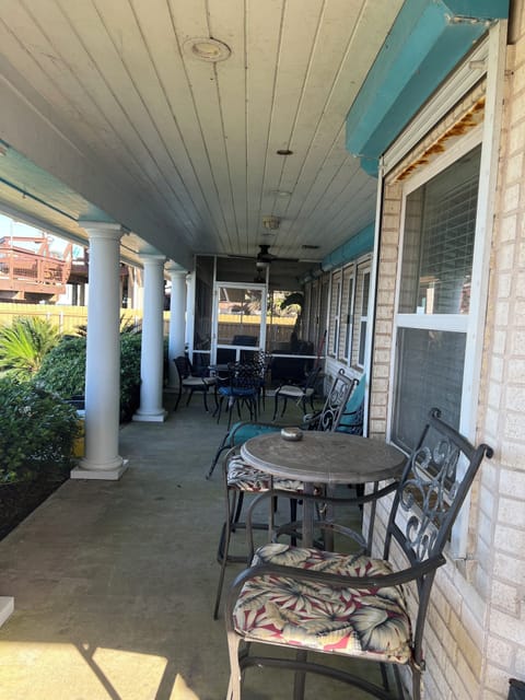 Photo of the backyard large covered patio with lots of seating