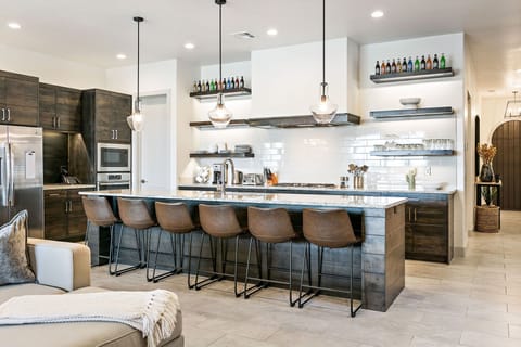 Expansive kitchen area with plenty of barstool seating