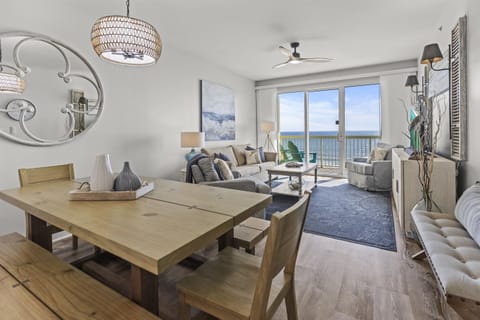 Your ocean-view retreat awaits with stylish coastal décor, comfortable seating, and endless blue horizons through floor-to-ceiling windows.