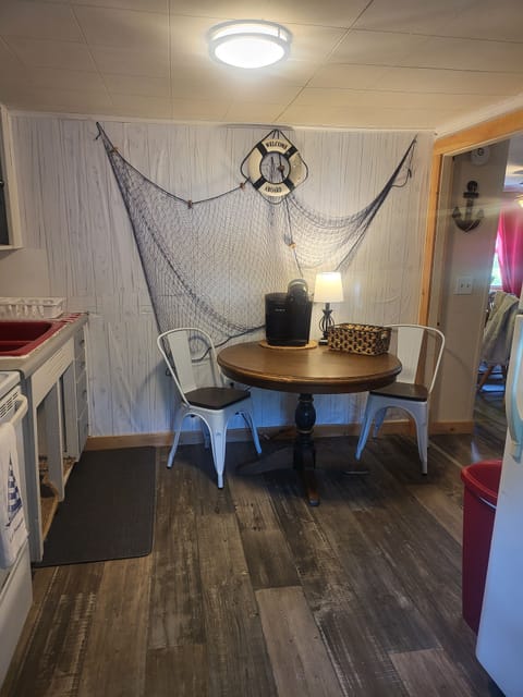 Breakfast table in the kitchen with dual Keurig coffee maker. 