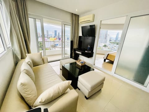 Apartment, 1 King Bed | Living area | 32-inch flat-screen TV with cable channels, TV