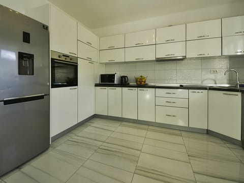 Cabinetry, Countertop, Kitchen Stove, Kitchen Appliance, Kitchen, Drawer, Building, Sink, Flooring, Interior Design