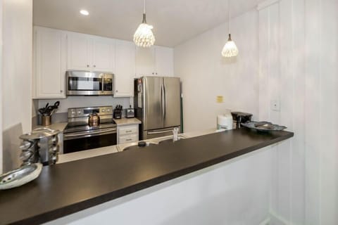 Fully equipped kitchen with dishes, pots and pans, cooking utensils, and everything you need to serve up some tasty meals!