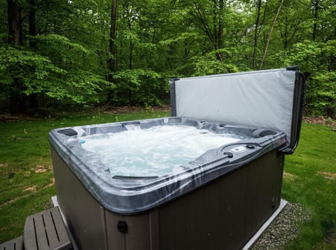 Enjoy nature and a glass of wine while relaxing in a hot tub